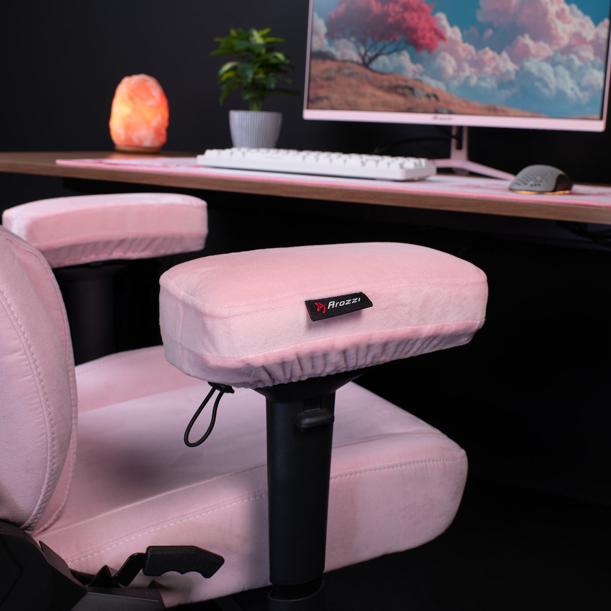 Arozzi Europe Memory Foam Armrest Pads on an office chair by a desk with computer and decor.