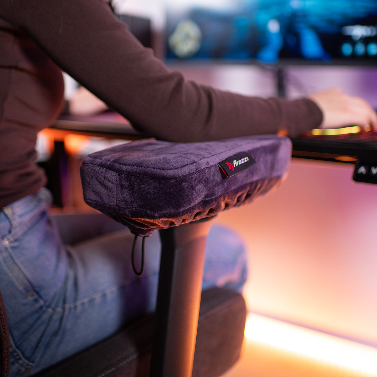 User with Arozzi Europe Memory Foam Armrest Pads on chair at computer desk.