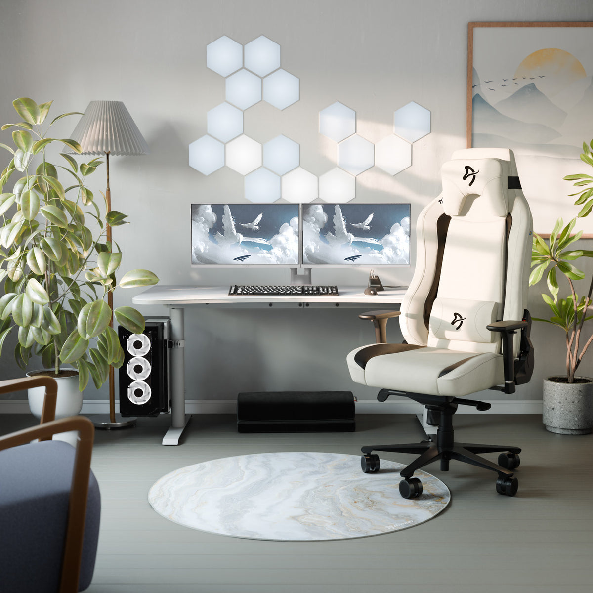 Modern setup with two Arozzi Nova 24″ IPS 200Hz monitors, white chair, plants & hexagon lights.