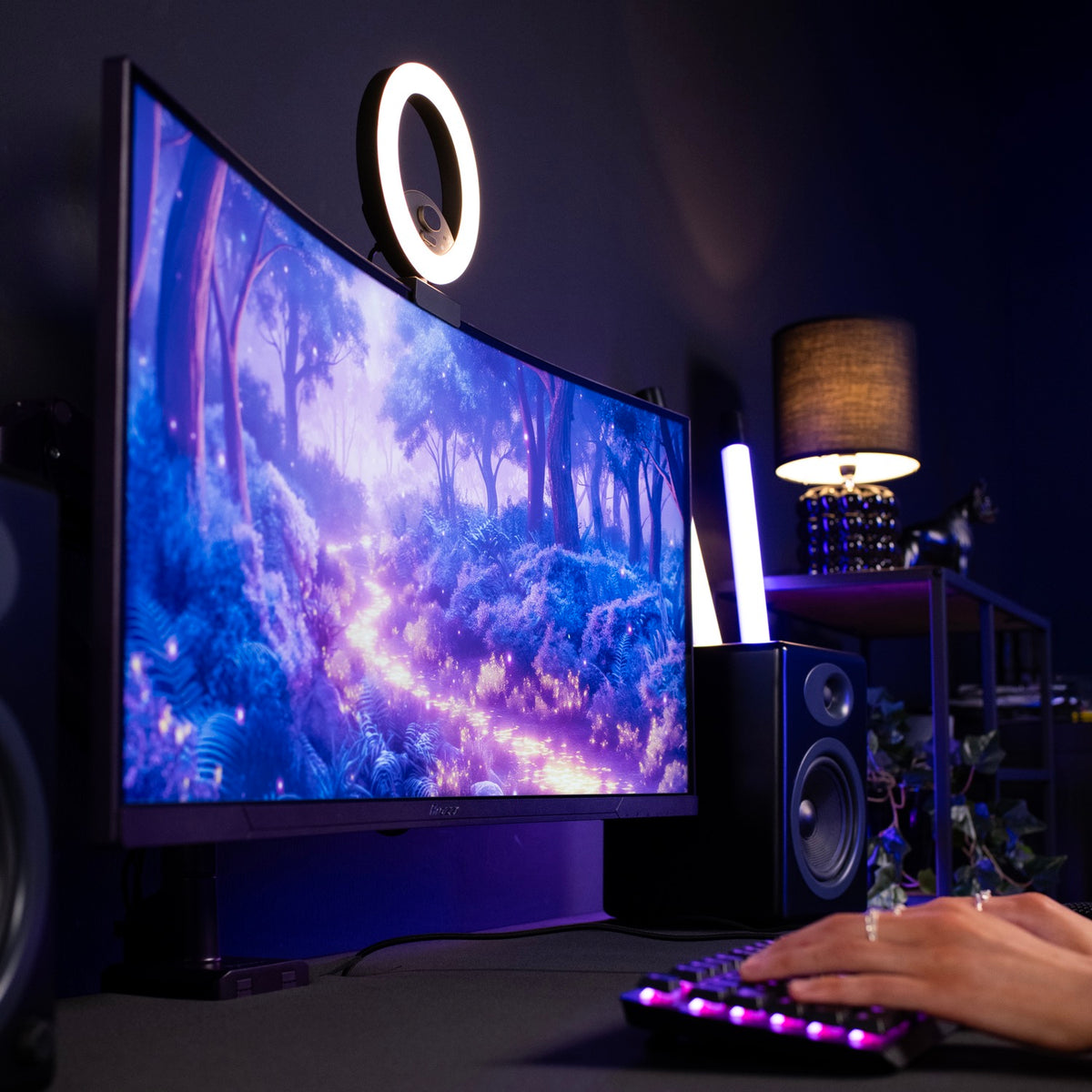 Arozzi Europe Nova 34″ curved VA 165Hz gaming monitor with RGB keyboard and fantasy forest scene.