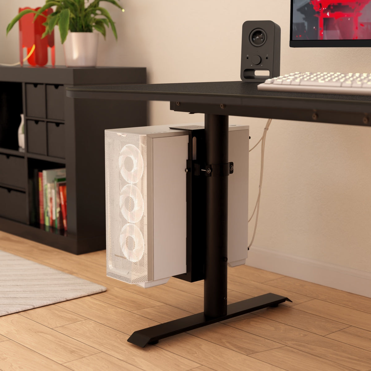 Arozzi Europe Arena PC Mount with white case under black desk on light wood floor.