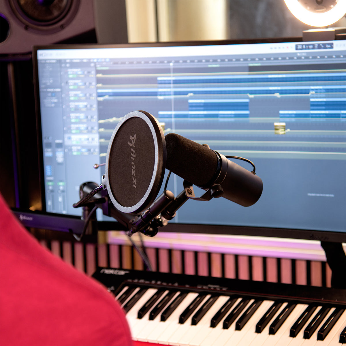 Arozzi Europe Pop Filter set up for studio recording with music software onscreen.