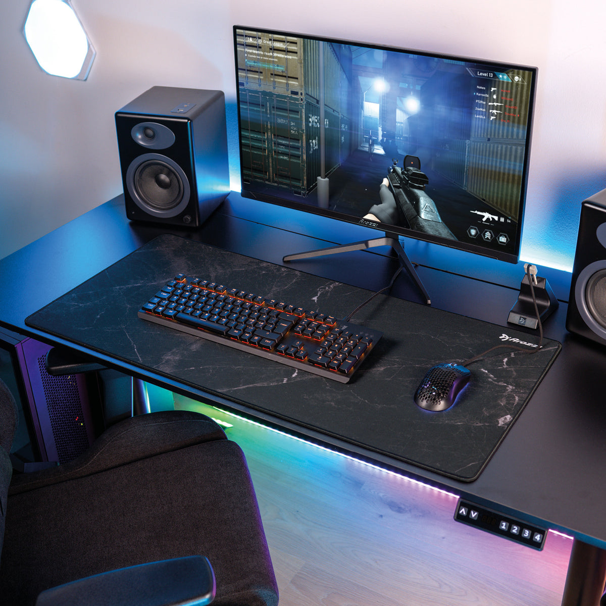 Arozzi Europe Zona Mousepad-Extra Large, monitor, and LED lights complete the gaming setup.