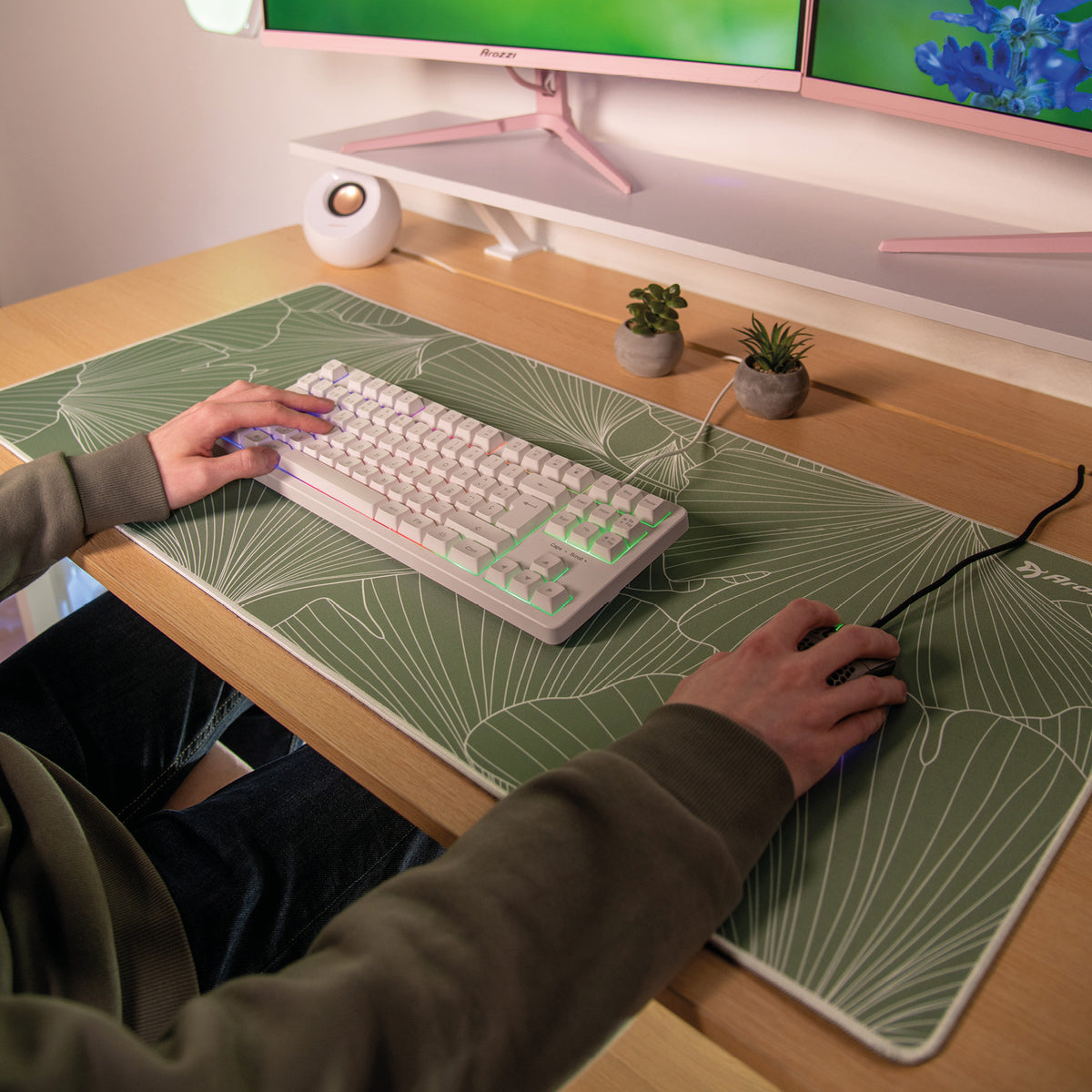 User on Arozzi Europe Zona Mousepad - Extra Large, white keyboard, and small plants nearby.