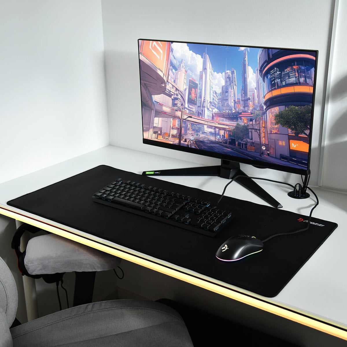 A gaming setup with monitor, keyboard, mouse, and Arozzi Europe Zona Mousepad on a white desk.