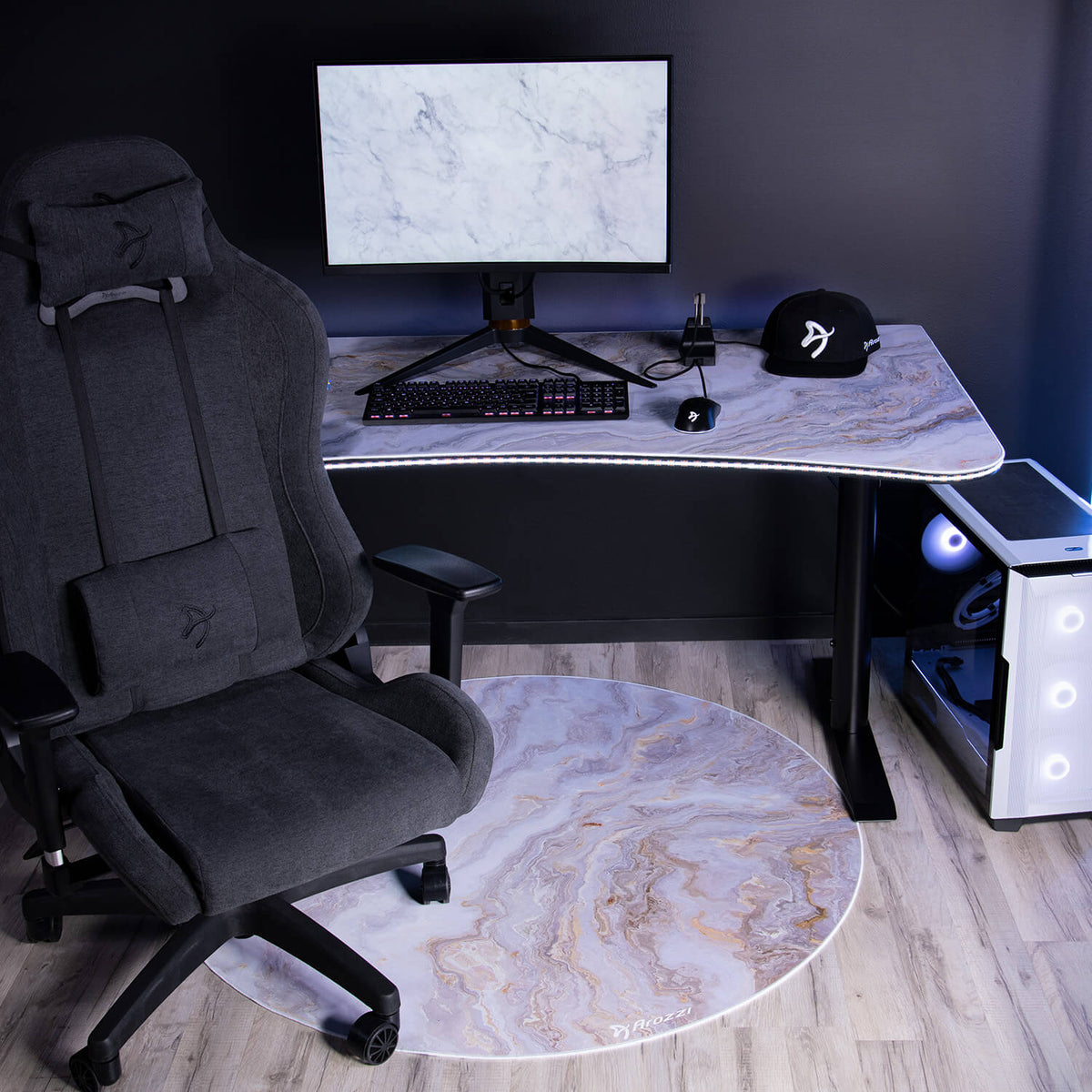 Arozzi Europe Zona Round Floor Pad adds comfort to your modern gaming office with marble desk.