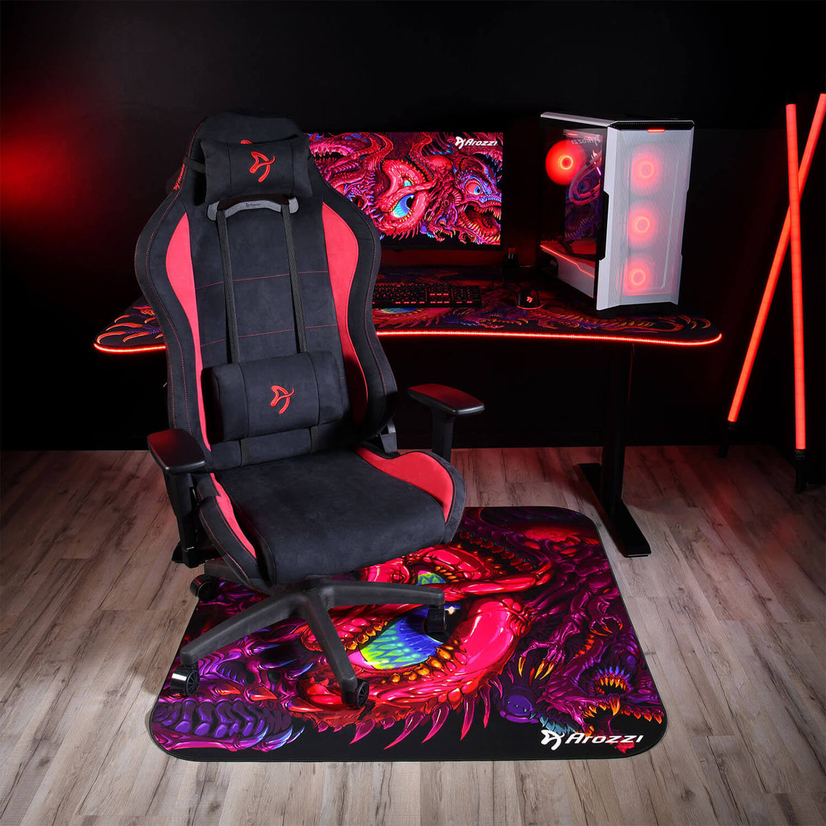 A gaming chair, desk with dragon art, and Arozzi Europe Zona Square Floor Pad for comfort.
