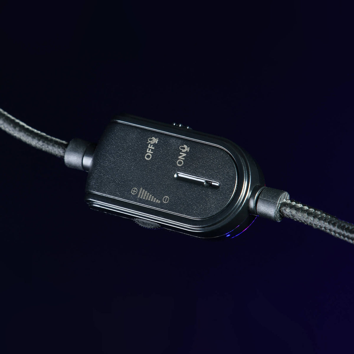 Close-up of a black inline switch on a braided cable, showing OFF and ON labels.