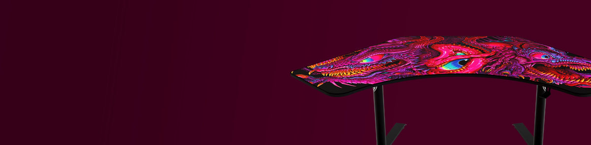 Curved desk with vivid, colorful dragon artwork on a dark burgundy background.