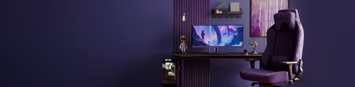 Purple-themed gaming setup with desk, monitor, gaming chair, and decorative items.