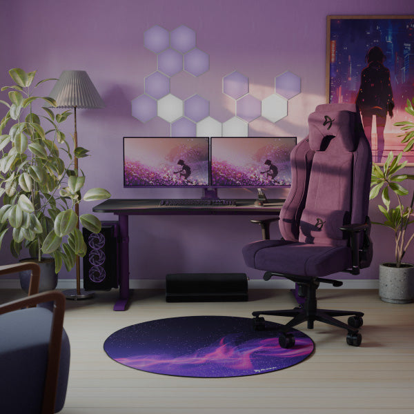 Purple-themed gaming setup with two monitors, a gaming chair, plants, and wall lights.