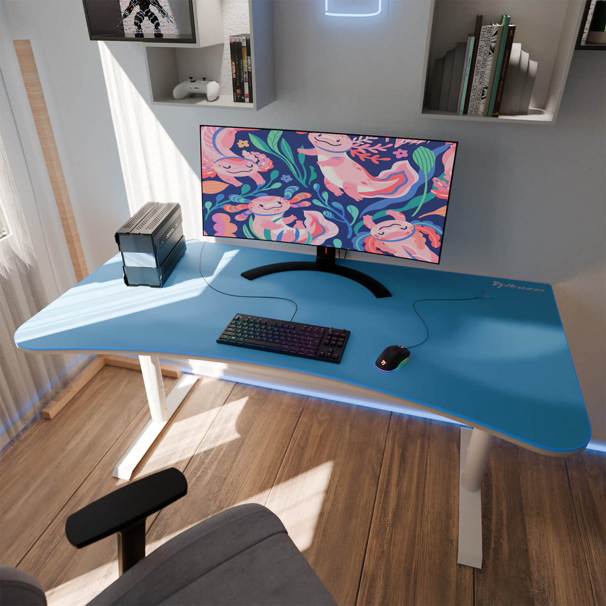 Blue desk with monitor, keyboard, Arena Mousepad by Arozzi Europe, small PC, and sloth wallpaper.