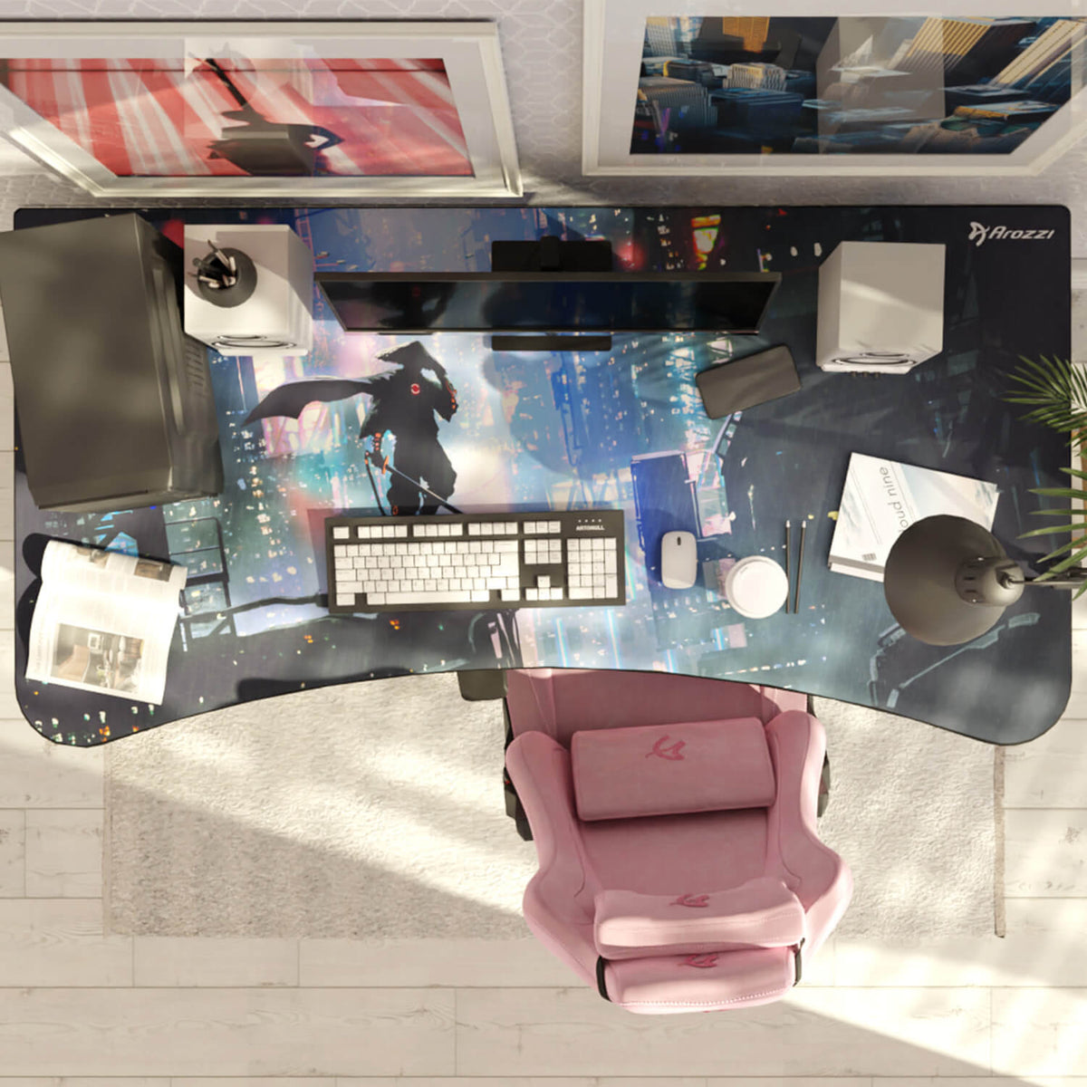 Top view of a computer desk with keyboard, lamp, and Arozzi Europe Arena Mousepad by the pink chair.