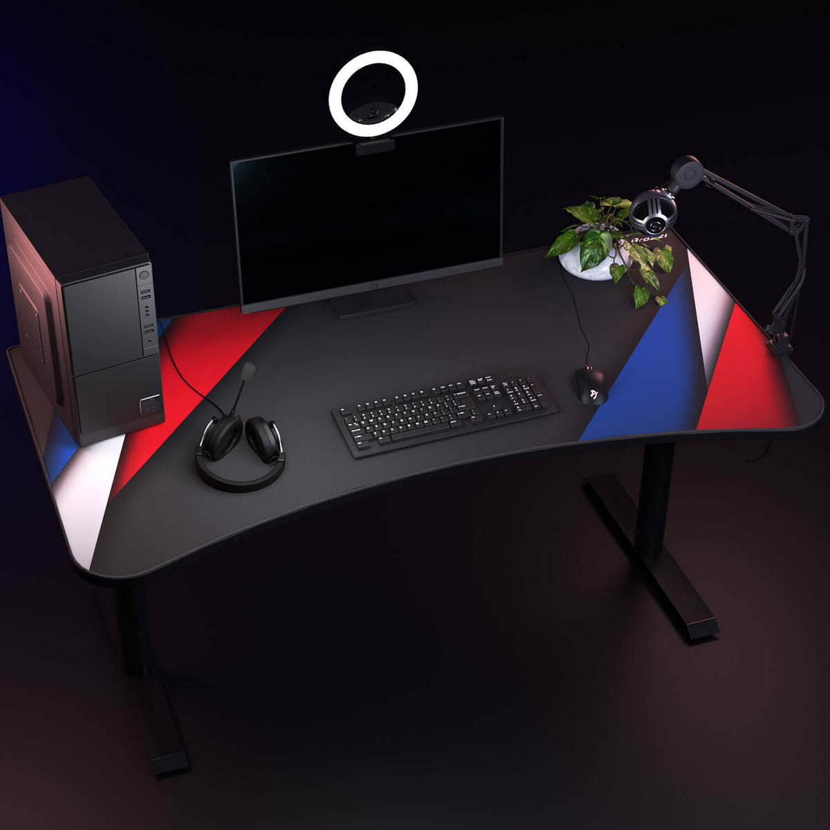 Curved desk, PC, Arozzi Europe Arena Mousepad, monitor, keyboard, lamp, plant, stripes.