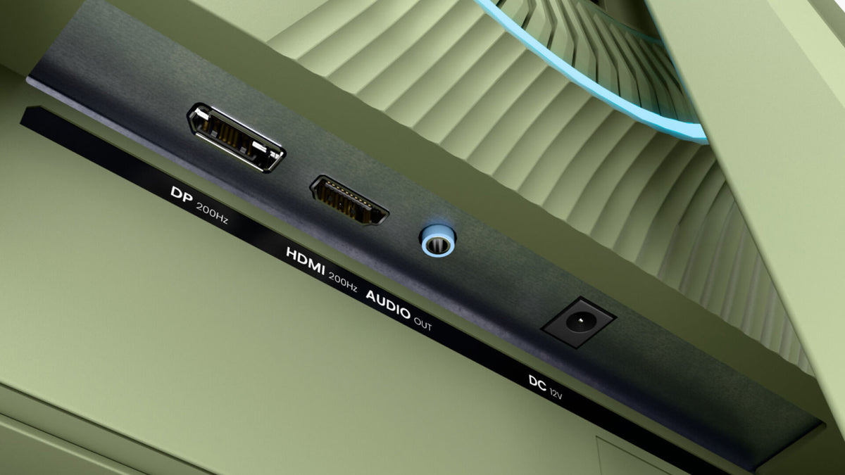 Monitor ports labeled DP, HDMI, AUDIO OUT, and DC on a green computer monitor.