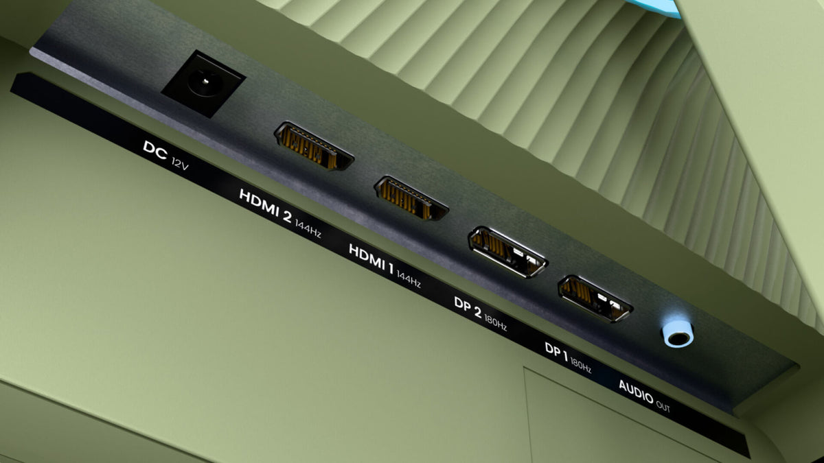Close-up of monitor ports: DC, two HDMI, two DisplayPort, and one audio out jack.