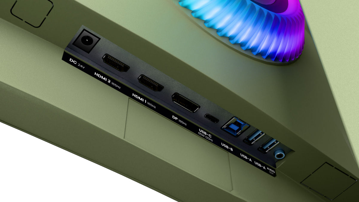 Close-up of monitor ports including HDMI, DP, USB, and a glowing RGB light on the top edge.