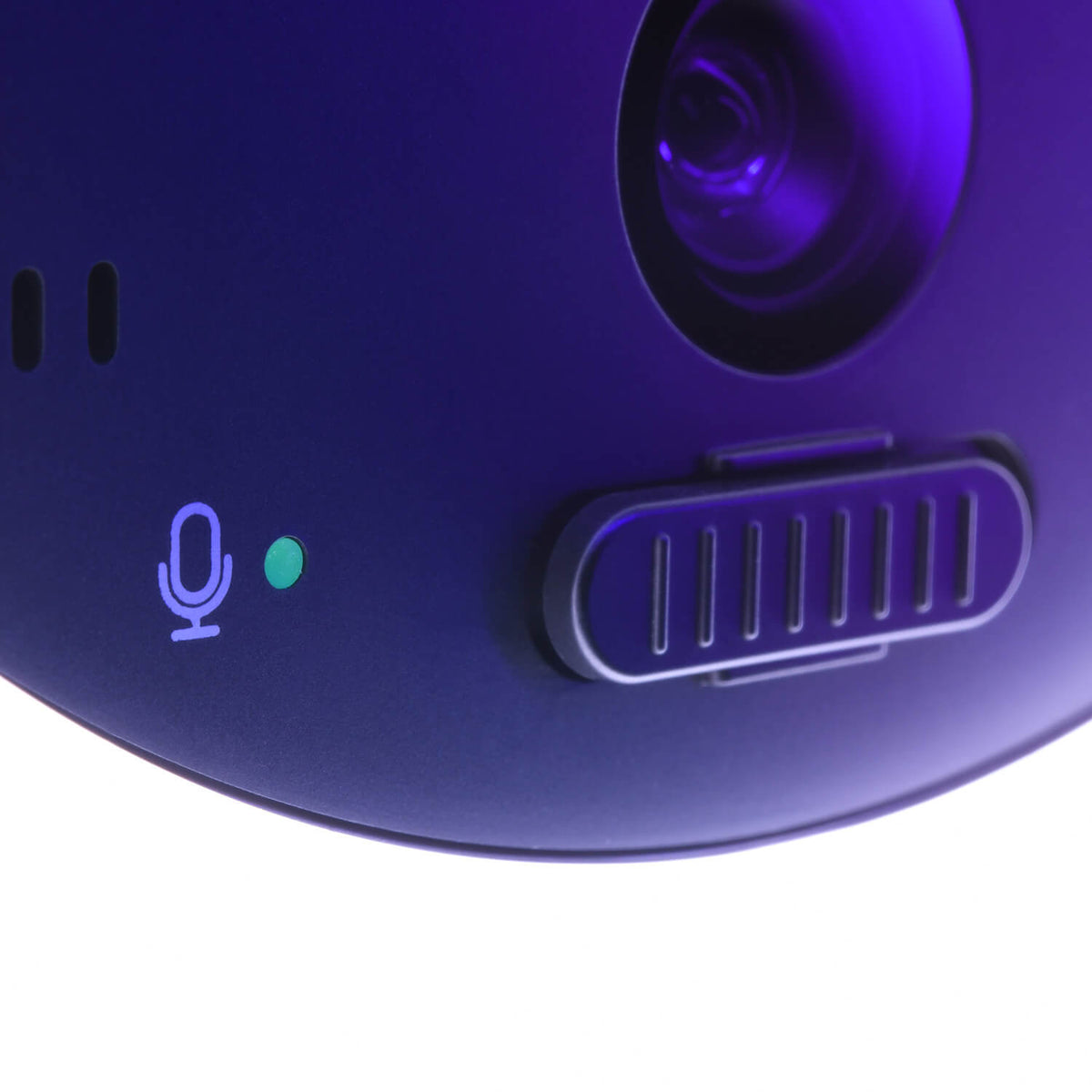 Close-up of a camera lens, microphone icon with green light, and a sliding switch.