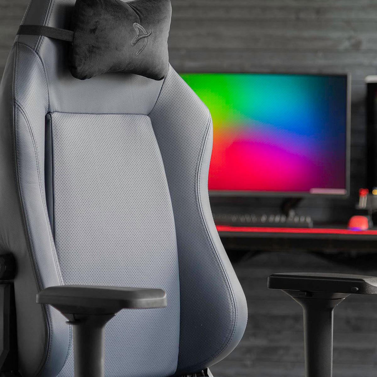 Arozzi Europe Primo - Full Premium Leather chair facing a monitor with colorful gradient display.