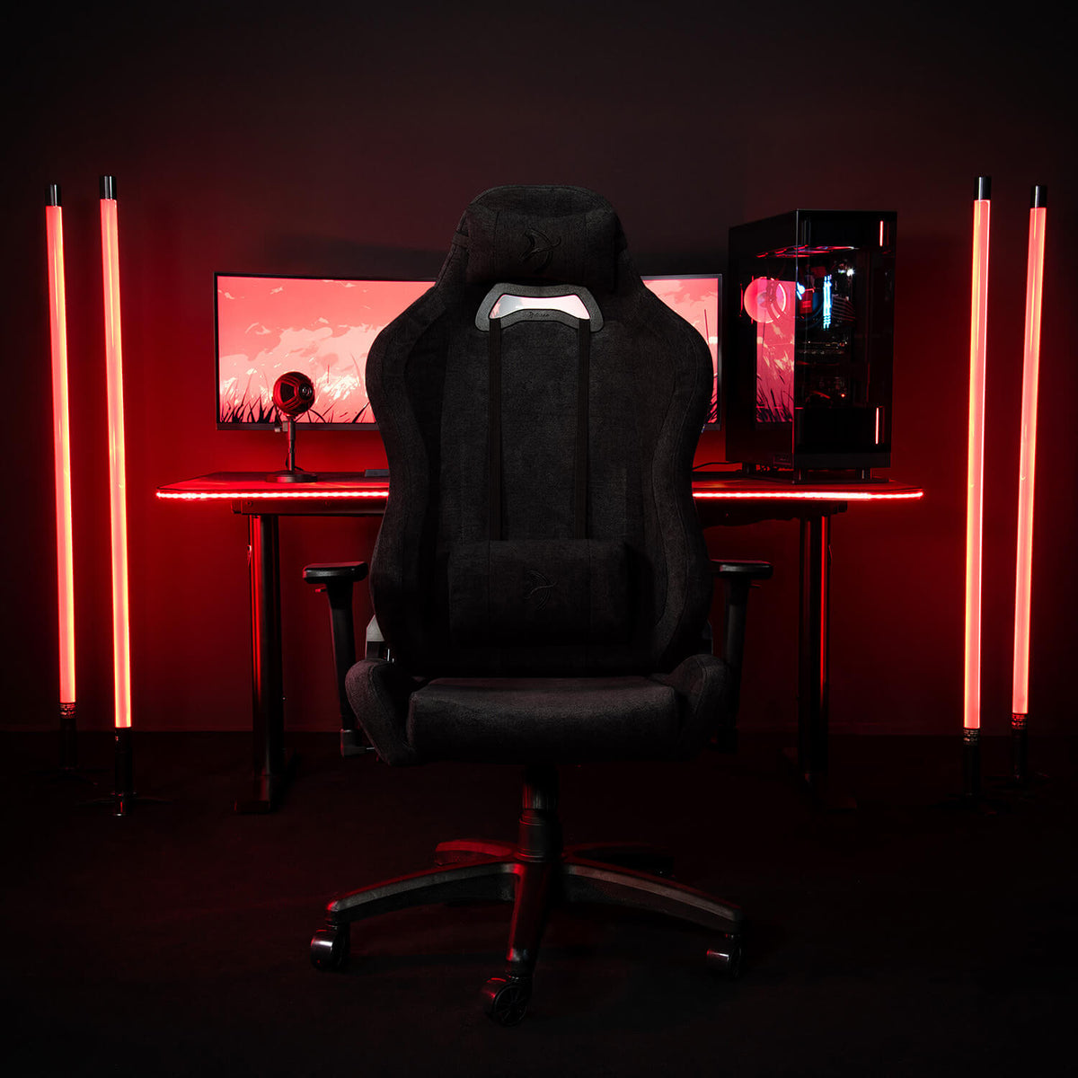 Arozzi Europe Torretta Soft Fabric chair at a PC desk with red LEDs and a wide monitor.