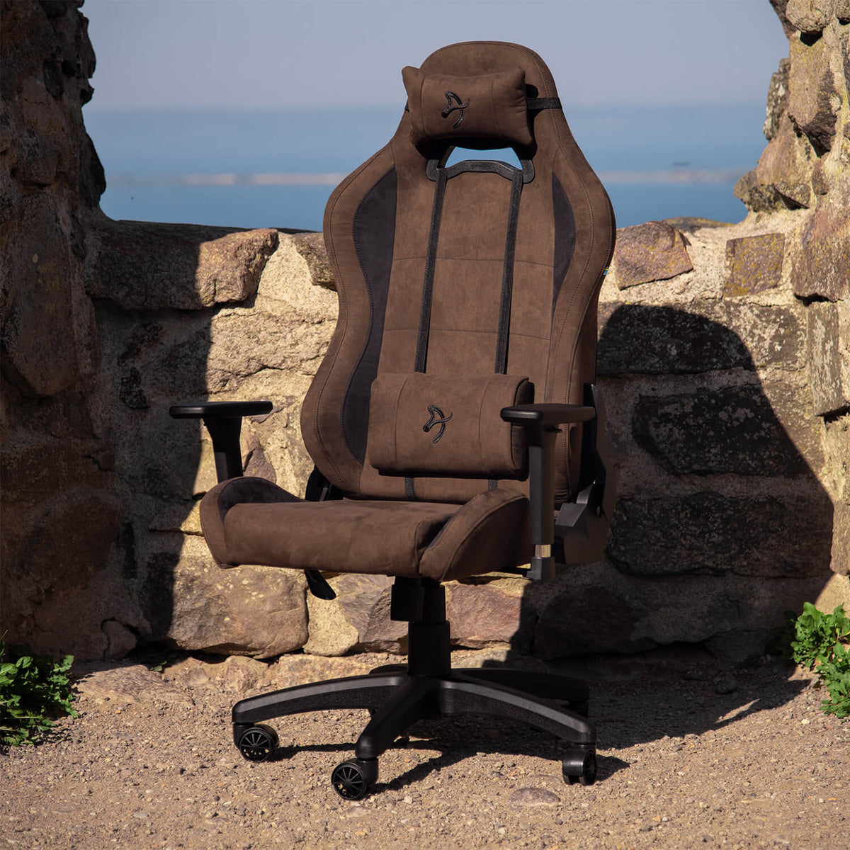 Arozzi Europe Torretta Supersoft brown ergonomic chair with headrest, armrests, and support pillows.
