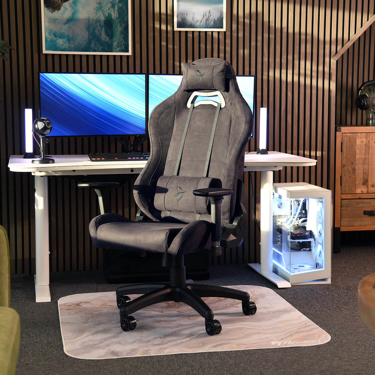 Arozzi Europe Torretta Supersoft chair with support pillows in front of dual monitors and PC.