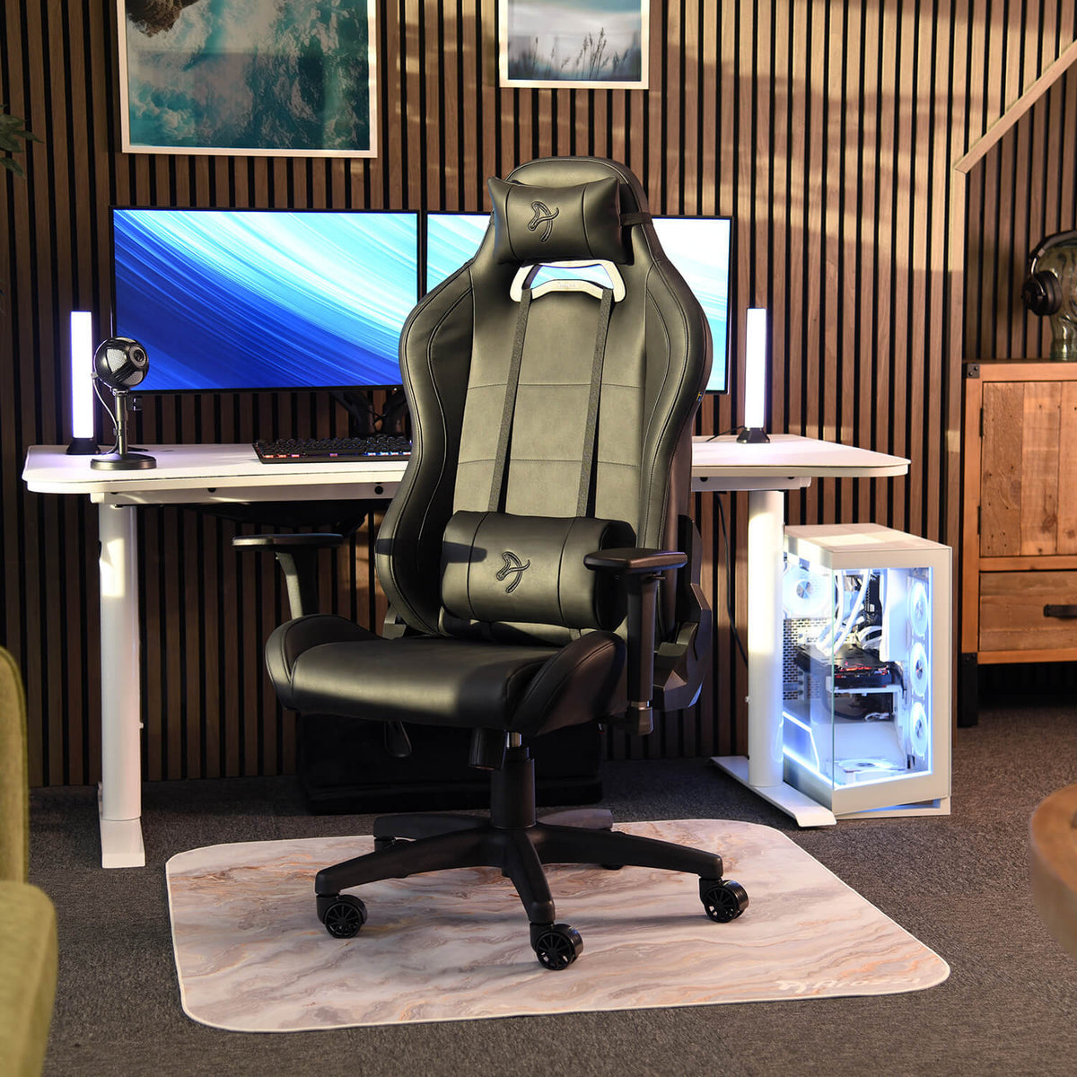 Arozzi Torretta SoftPU ergonomic chair with lumbar support in a modern dual monitor setup.