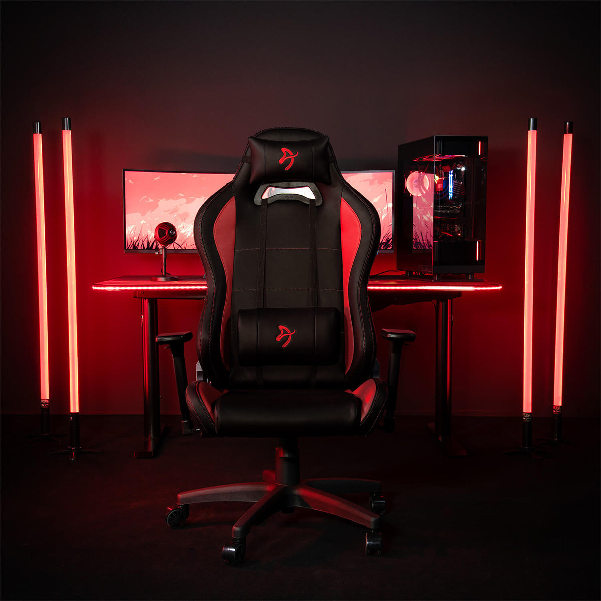 Arozzi Europe Torretta SoftPU chair with lumbar support in front of a red-lit computer setup.