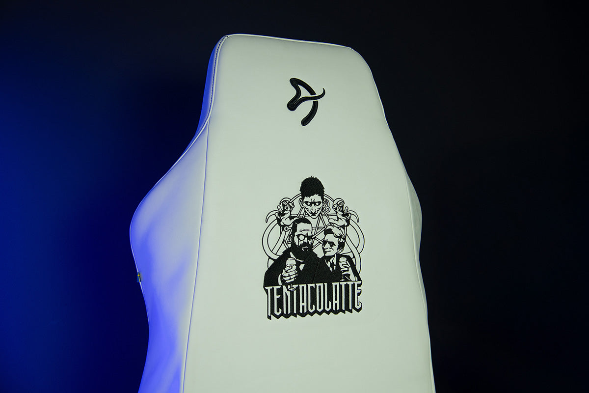 White gaming chair with black tentacled creature graphic and the word TENTACULATE on the back.