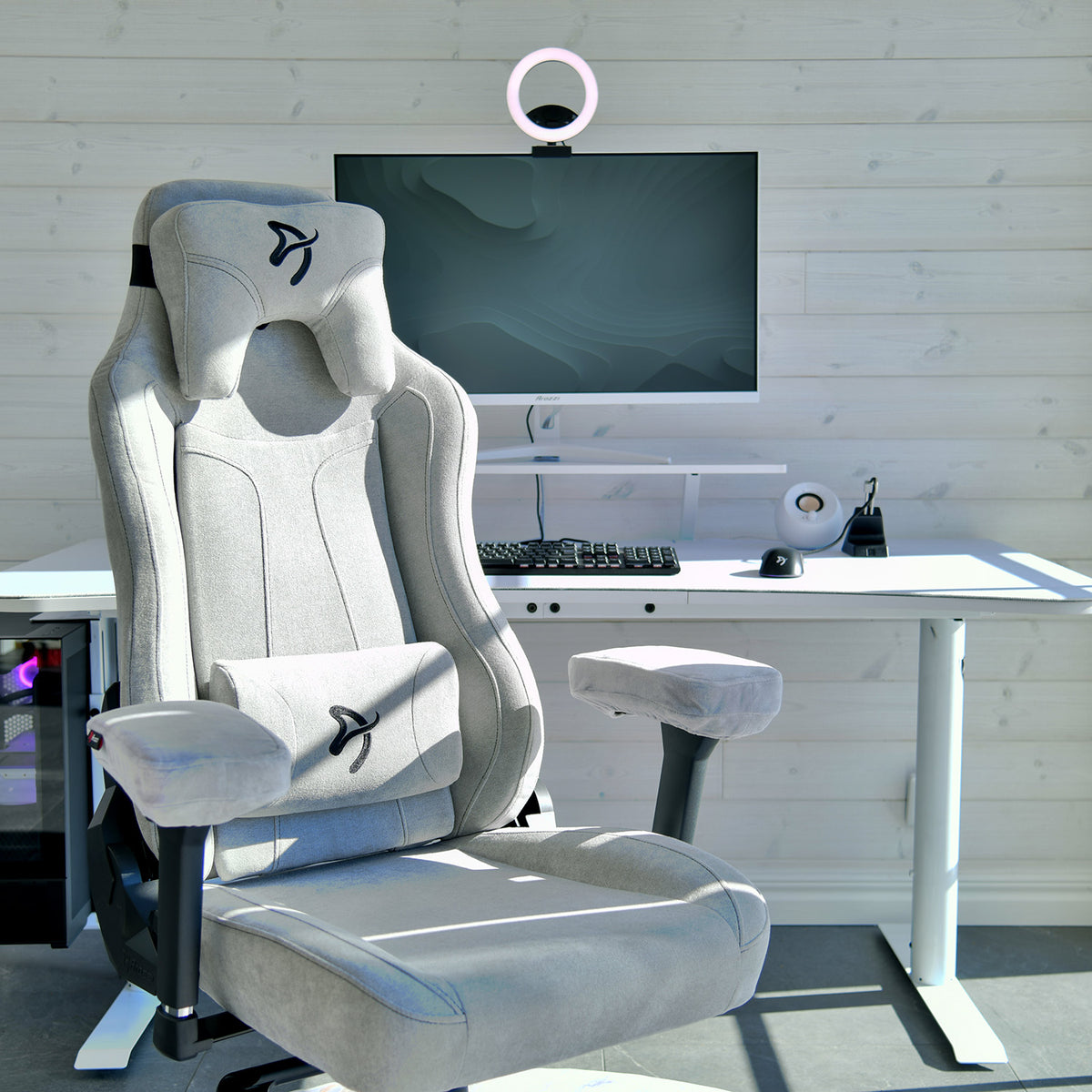 Arozzi Europe Vernazza Soft Fabric chair, gray, adjustable height; at a white desk in bright room.