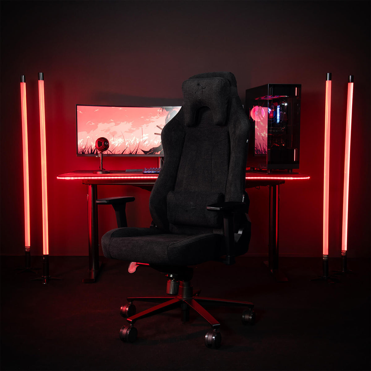 Arozzi Europe Vernazza Soft Fabric chair with adjustable height in front of a desk and monitor.