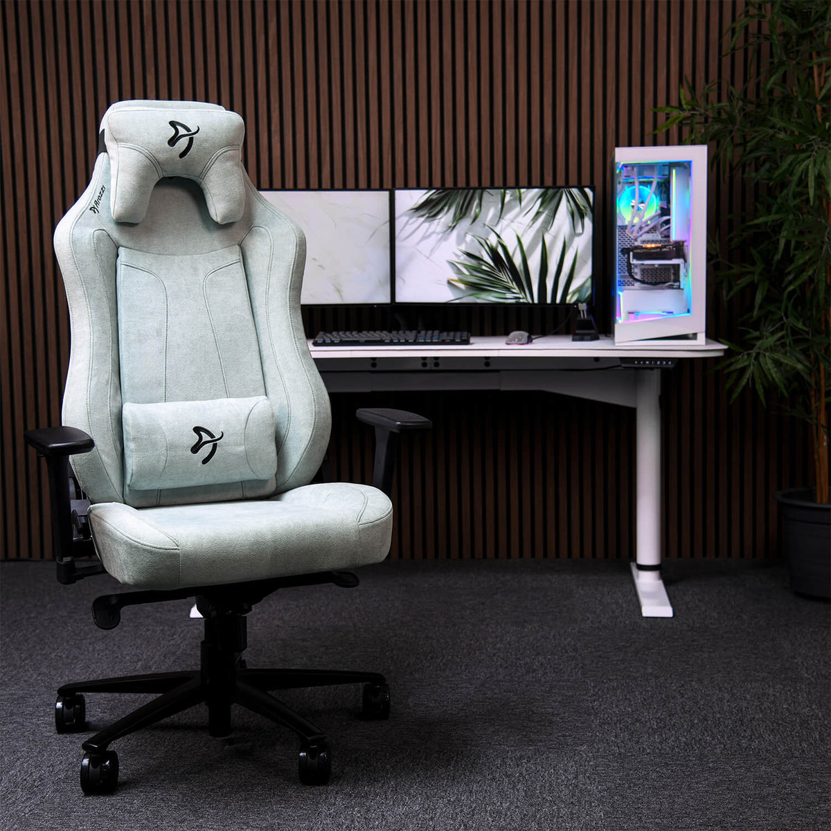 Arozzi Europe Vernazza Soft Fabric chair in front of a modern desk with dual monitors.
