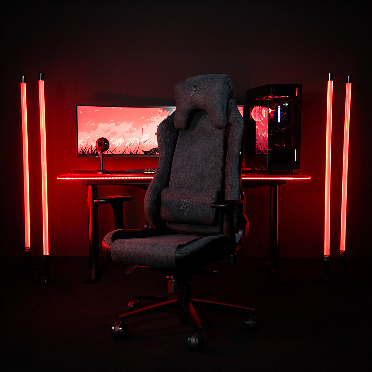 Arozzi Europe Vernazza Vento gaming chair at PC desk with red lights and four red light tubes.