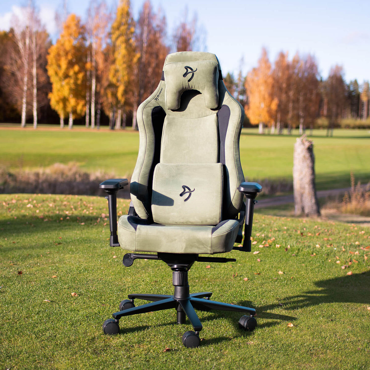 Arozzi Europe Vernazza Supersoft green gaming chair with memory foam, outdoors in autumn scene.
