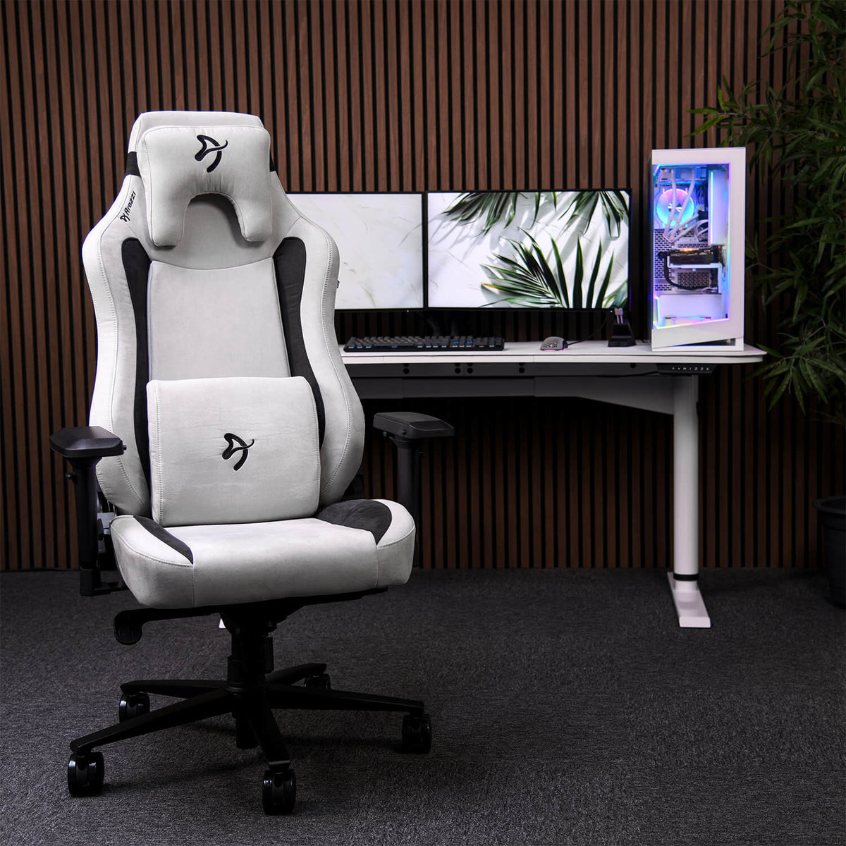 Arozzi Vernazza Supersoft chair with airy fabric faces dual monitors and a glowing PC setup.