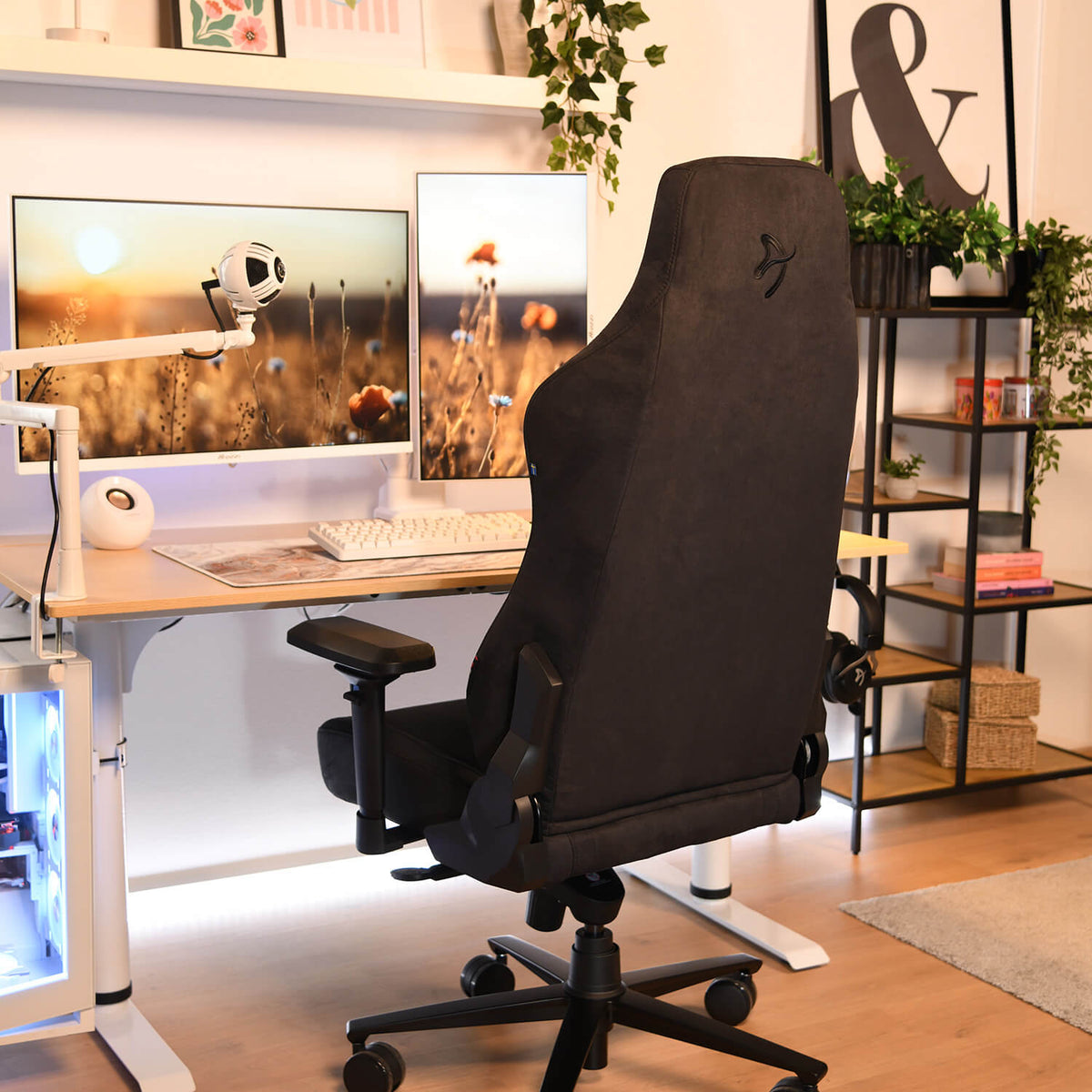 Vernazza Supersoft by Arozzi Europe at a modern desk with dual monitors, plants, and pillows.