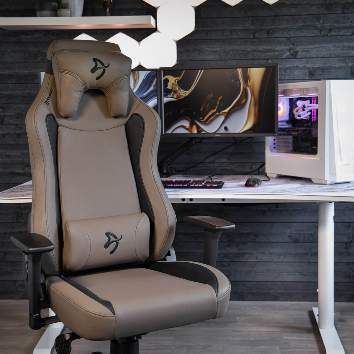 Arozzi Europe Vernazza SoftPU chair in black and brown at a white desk with dual monitors.