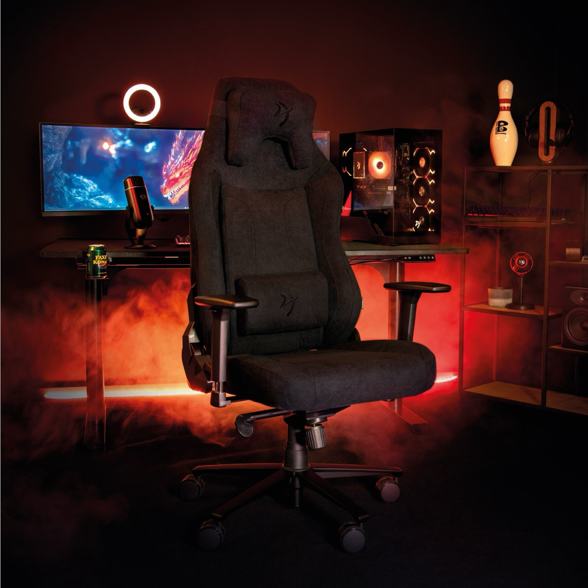 Arozzi Europe Vernazza XL Soft Fabric gaming chair at desk with PC, monitor, and red lighting.