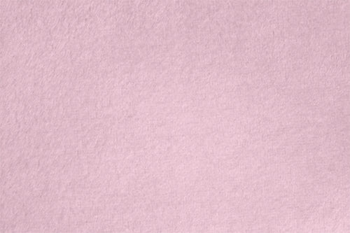 Light pink textured surface fills the image.