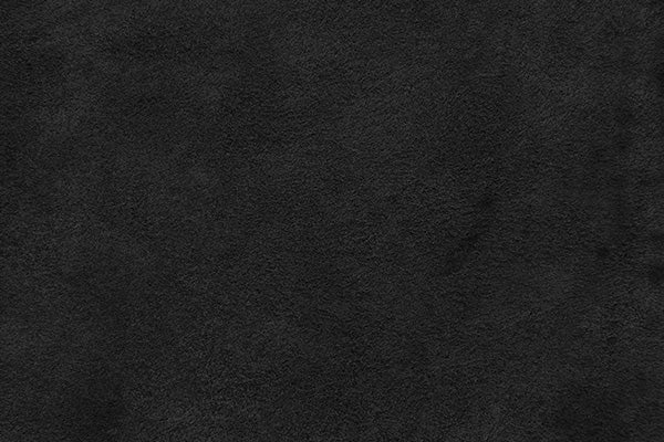 Dark black suede texture with a slightly soft, velvety and uniform appearance.