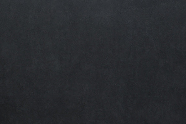 Solid black textured surface.